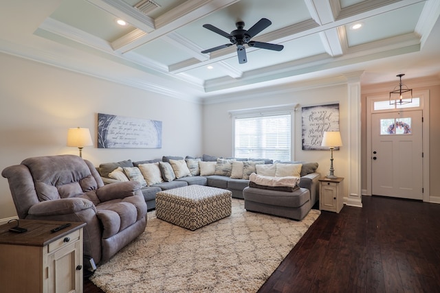 living room featuring ceiling fan, coffered ceiling, beamed ceiling, wood-type flooring, and ornamental molding