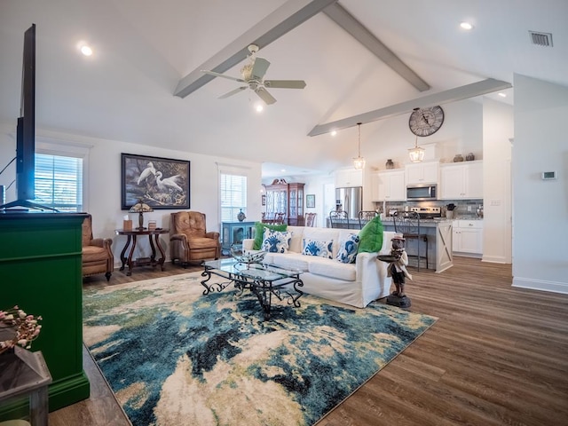 living room featuring visible vents, dark wood-style floors, ceiling fan, high vaulted ceiling, and beam ceiling