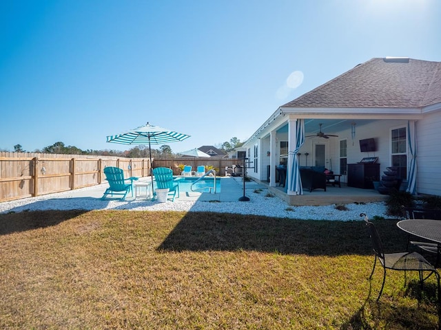 exterior space featuring a fenced backyard, a fenced in pool, a ceiling fan, and a patio