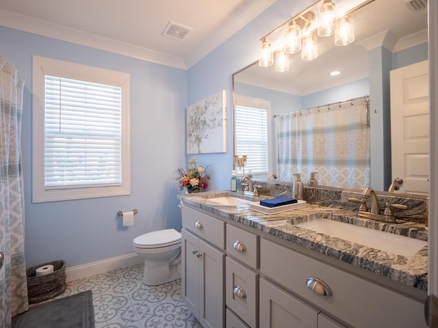 full bath with a healthy amount of sunlight, visible vents, and a sink