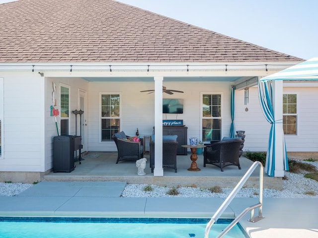 rear view of property featuring a shingled roof, an outdoor hangout area, a porch, and a ceiling fan