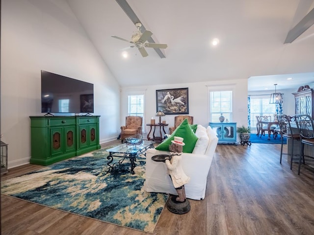 living area featuring high vaulted ceiling, ceiling fan, baseboards, and wood finished floors