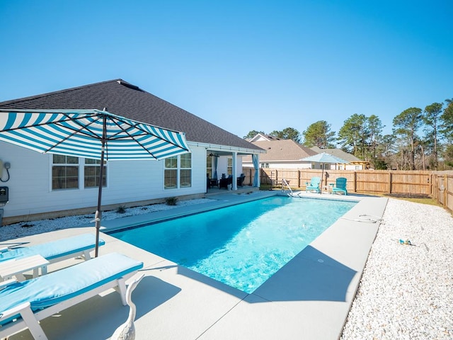 view of pool with a patio, a fenced backyard, and a fenced in pool