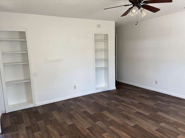 unfurnished bedroom with a textured ceiling, ceiling fan, and dark hardwood / wood-style flooring