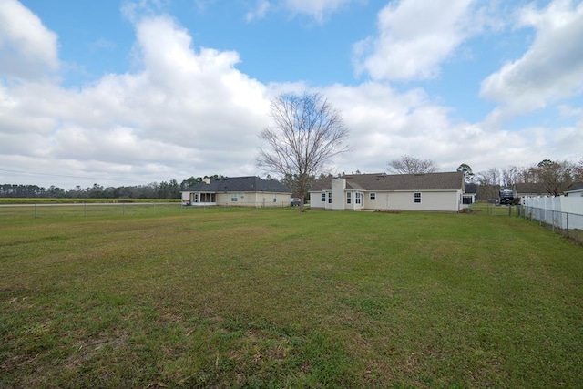 view of yard with fence