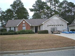 single story home with concrete driveway