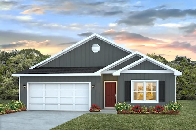 view of front facade featuring a lawn and a garage