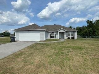 ranch-style house with fence, driveway, a front lawn, and a garage