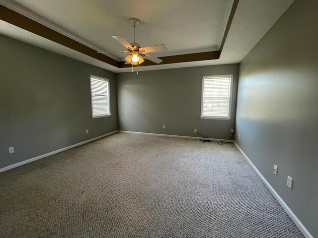 4331 Summerlin Dr, Valdosta, GA 31605 - carpeted spare room with baseboards, a raised ceiling, and ceiling fan