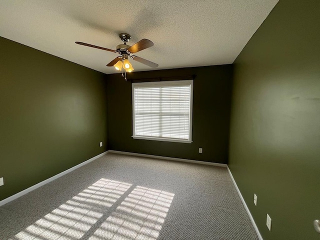 4331 Summerlin Dr, Valdosta, GA 31605 - carpeted spare room featuring baseboards, ceiling fan, and a textured ceiling
