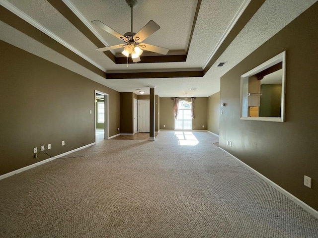 4331 Summerlin Dr, Valdosta, GA 31605 - empty room featuring carpet floors, baseboards, a textured ceiling, a tray ceiling, and a ceiling fan