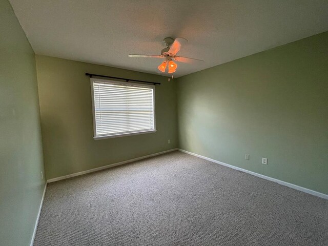 4331 Summerlin Dr, Valdosta, GA 31605 - spare room with carpet floors, a ceiling fan, and baseboards