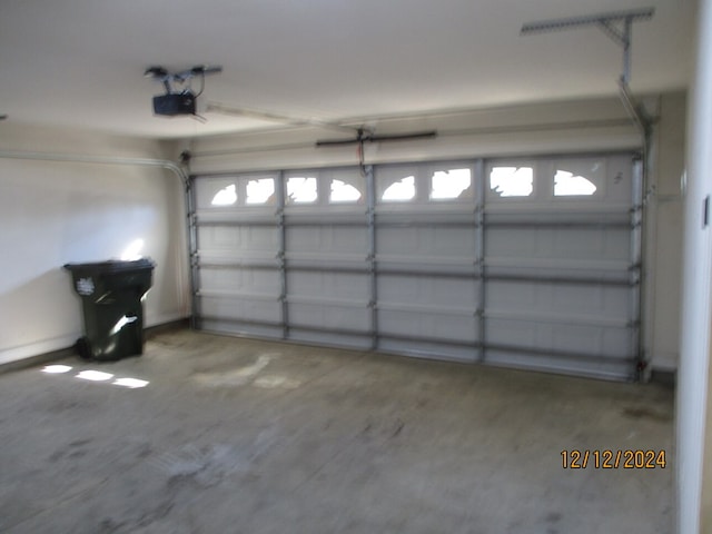 garage featuring a garage door opener