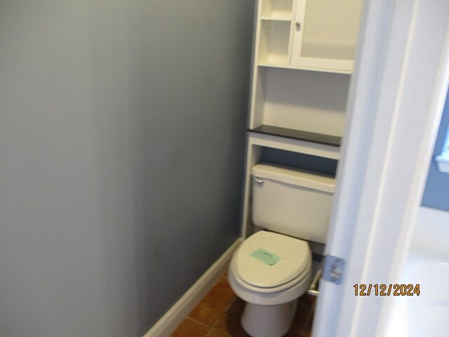 bathroom featuring tile patterned flooring and toilet