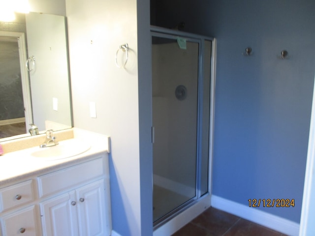 bathroom with vanity, tile patterned floors, and walk in shower