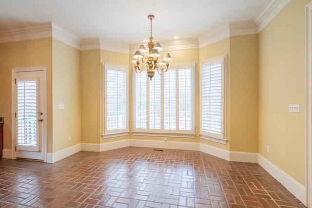 unfurnished room with an inviting chandelier, a wealth of natural light, and crown molding