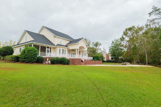 view of front of home featuring a front yard and covered porch