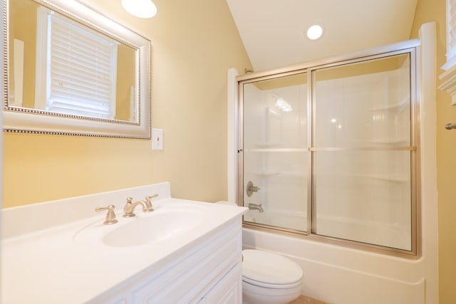 full bathroom featuring vanity, shower / bath combination with glass door, toilet, and lofted ceiling