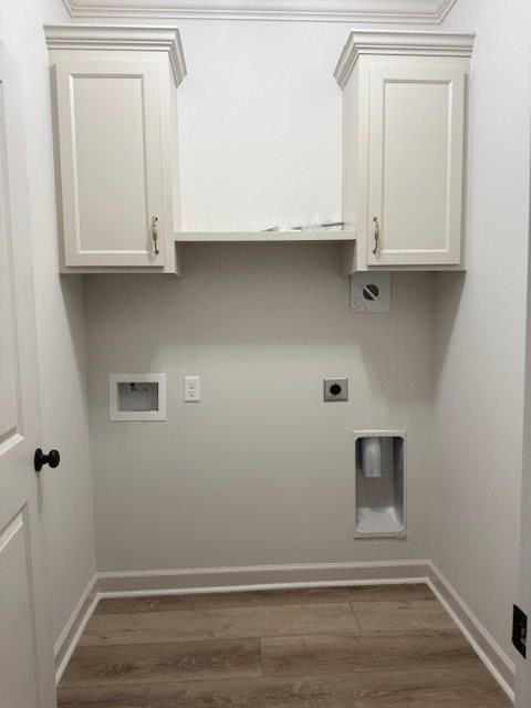 laundry area with cabinets, hookup for a washing machine, dark wood-type flooring, and hookup for an electric dryer