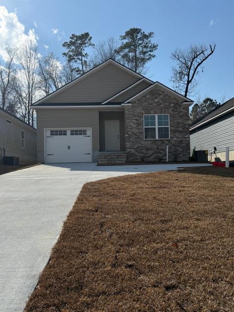 view of front of property with a garage and a front yard