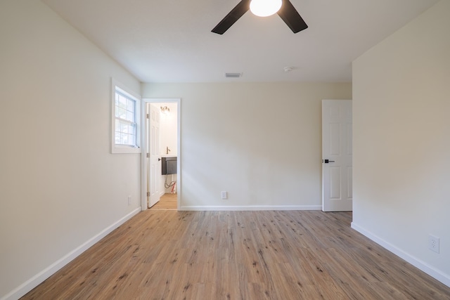 unfurnished room with ceiling fan and light hardwood / wood-style flooring