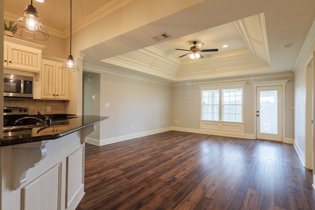 3982 Karaline Cir, Valdosta, GA 31605 - kitchen with appliances with stainless steel finishes, ceiling fan, crown molding, dark wood-style floors, and tasteful backsplash