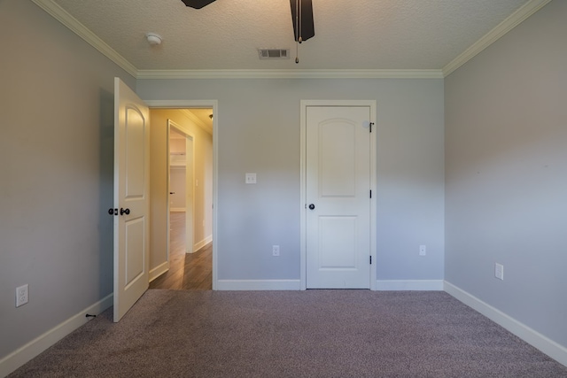 3982 Karaline Cir, Valdosta, GA 31605 - unfurnished bedroom featuring carpet floors, crown molding, a textured ceiling, and ceiling fan