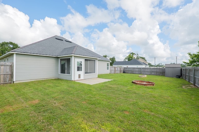 3982 Karaline Cir, Valdosta, GA 31605 - rear view of property with a fenced backyard, a shed, a shingled roof, and a patio