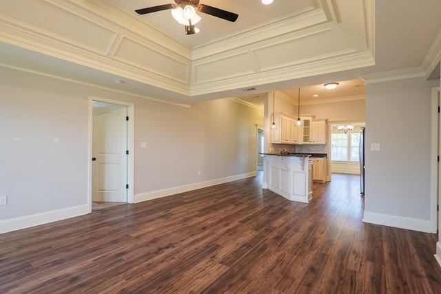 3982 Karaline Cir, Valdosta, GA 31605 - kitchen with dark countertops, open floor plan, ornamental molding, dark wood-style flooring, and a ceiling fan