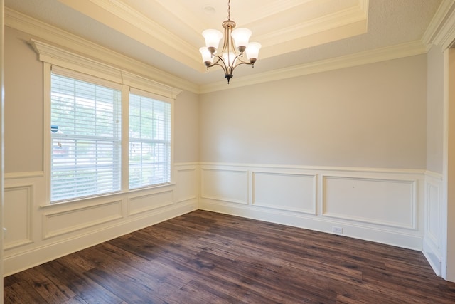 3982 Karaline Cir, Valdosta, GA 31605 - spare room with a chandelier, a raised ceiling, wainscoting, dark wood-style floors, and crown molding