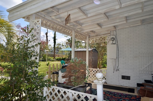 view of yard with a storage unit, an outdoor structure, and fence