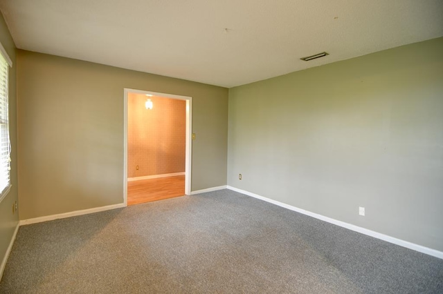 spare room featuring carpet