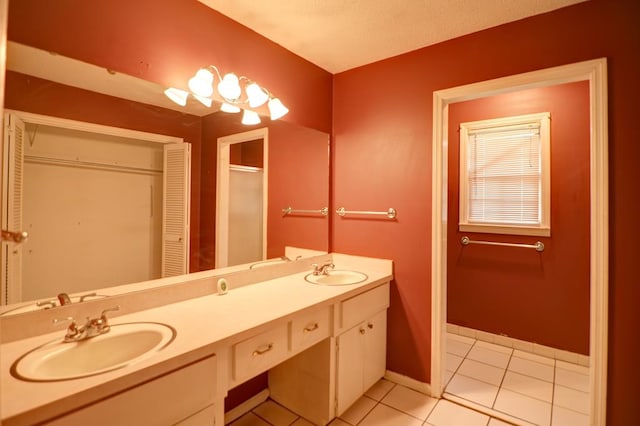 bathroom featuring tile patterned floors and vanity