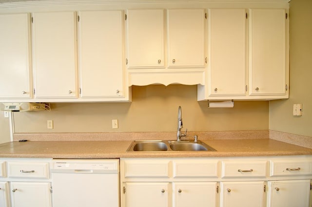 kitchen featuring white cabinetry, dishwasher, and sink