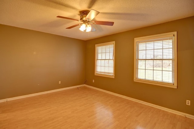 unfurnished room featuring ceiling fan, a textured ceiling, and hardwood / wood-style flooring