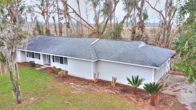 view of side of property featuring a yard