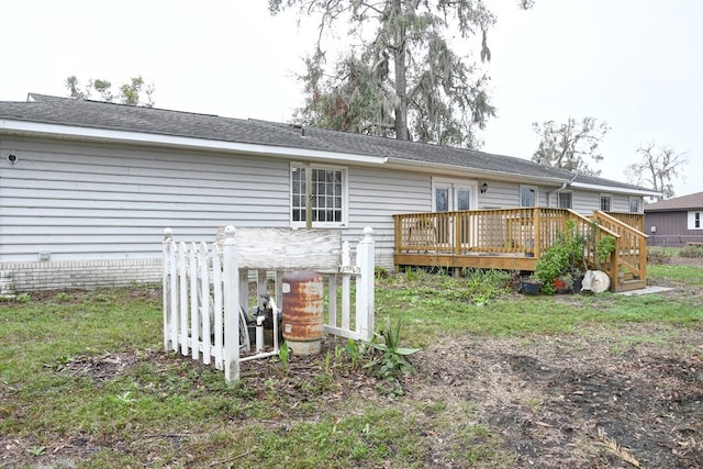 rear view of property with a deck