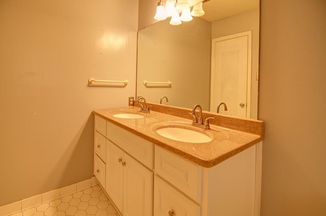 bathroom with tile patterned floors and vanity