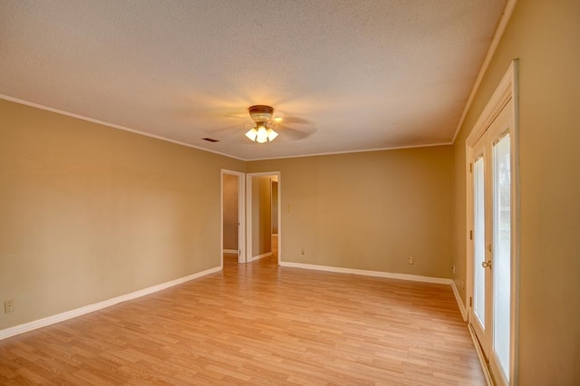 spare room featuring ceiling fan, light hardwood / wood-style floors, and ornamental molding