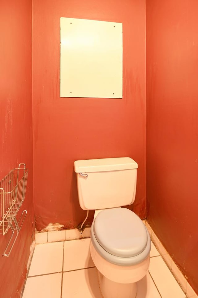 bathroom featuring tile patterned floors and toilet