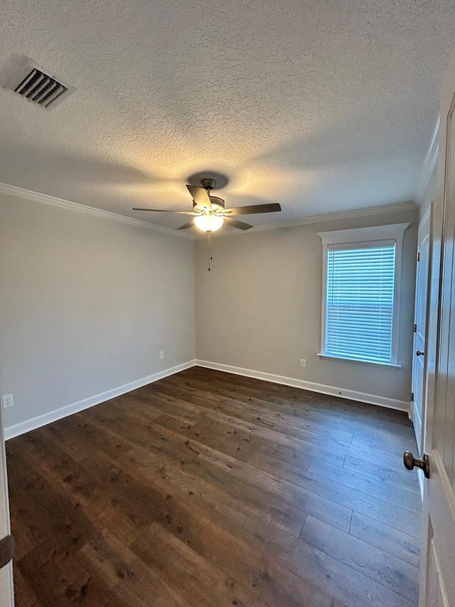 unfurnished room with a textured ceiling, crown molding, ceiling fan, and dark wood-type flooring