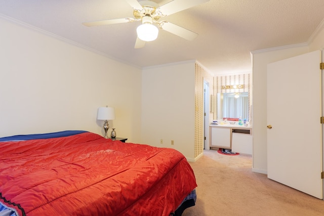 carpeted bedroom featuring crown molding, baseboards, and ceiling fan
