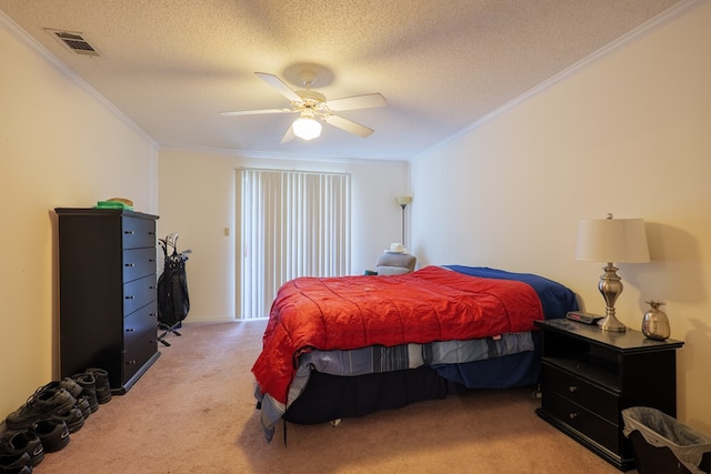 carpeted bedroom featuring visible vents, ornamental molding, a textured ceiling, and ceiling fan