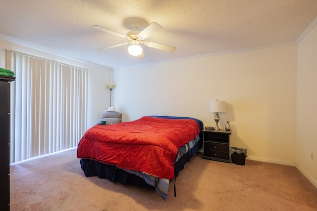 bedroom with crown molding, a ceiling fan, a textured ceiling, and carpet floors