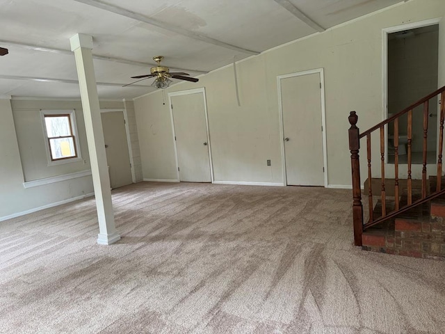 interior space with ceiling fan and light colored carpet