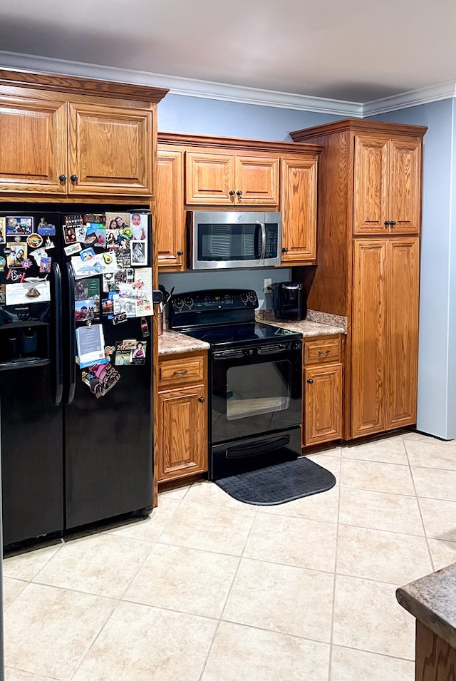 kitchen with brown cabinets, black appliances, and crown molding