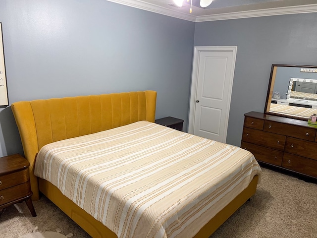 carpeted bedroom with ornamental molding