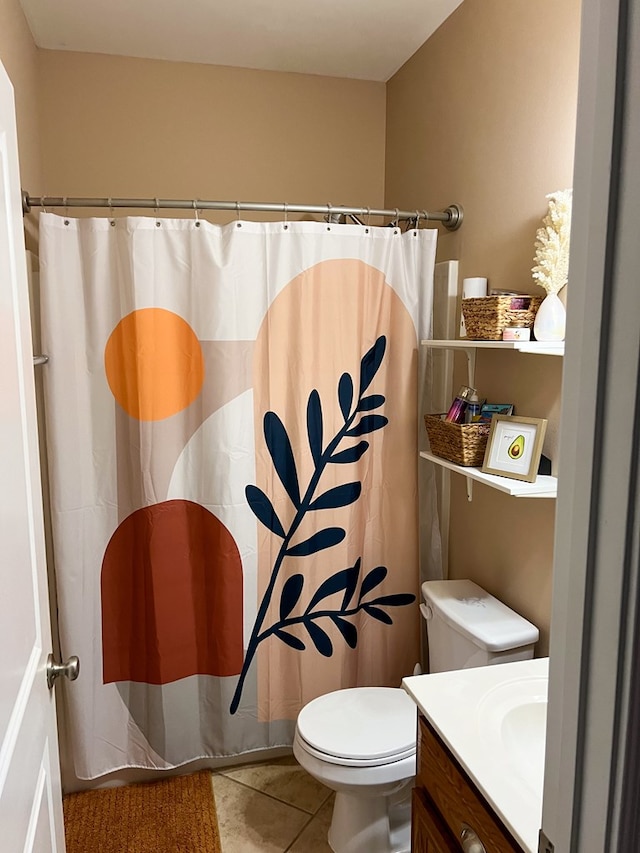 bathroom featuring tile patterned flooring, a shower with shower curtain, toilet, and vanity