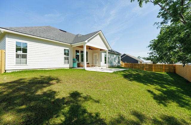 5039 Hatfield Cir, Hahira, GA 31632 - back of property featuring ceiling fan, a patio area, and roof with shingles