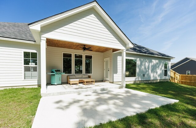 5039 Hatfield Cir, Hahira, GA 31632 - back of property with ceiling fan, a patio area, a shingled roof, and outdoor lounge area